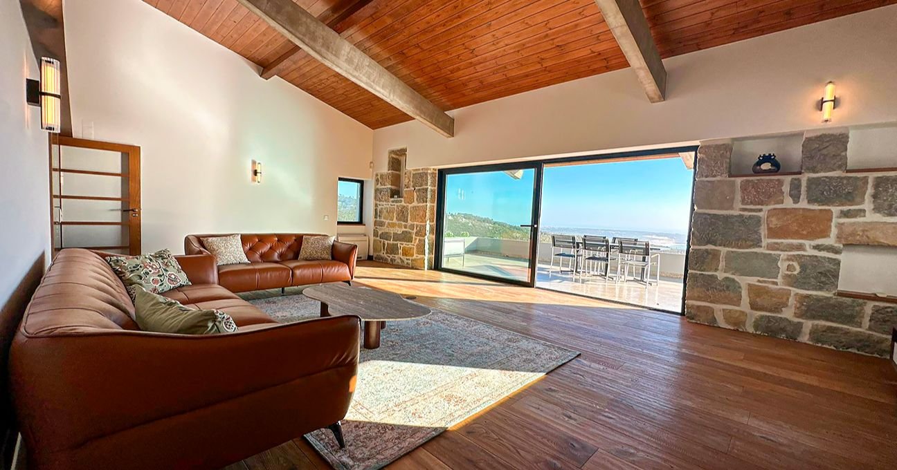 Spacious Panorama Residence sitting room with panoramic windows and natural light