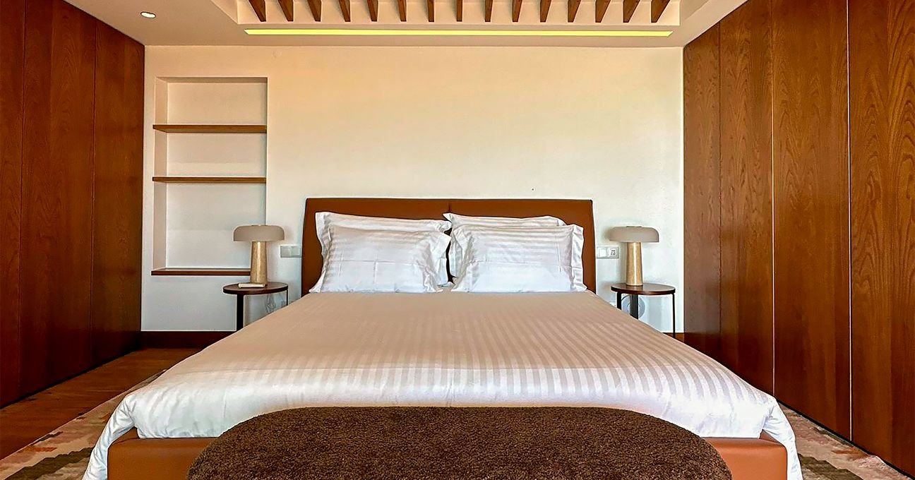 Boutique hotel bedroom with comfortable bedding and refined interior details