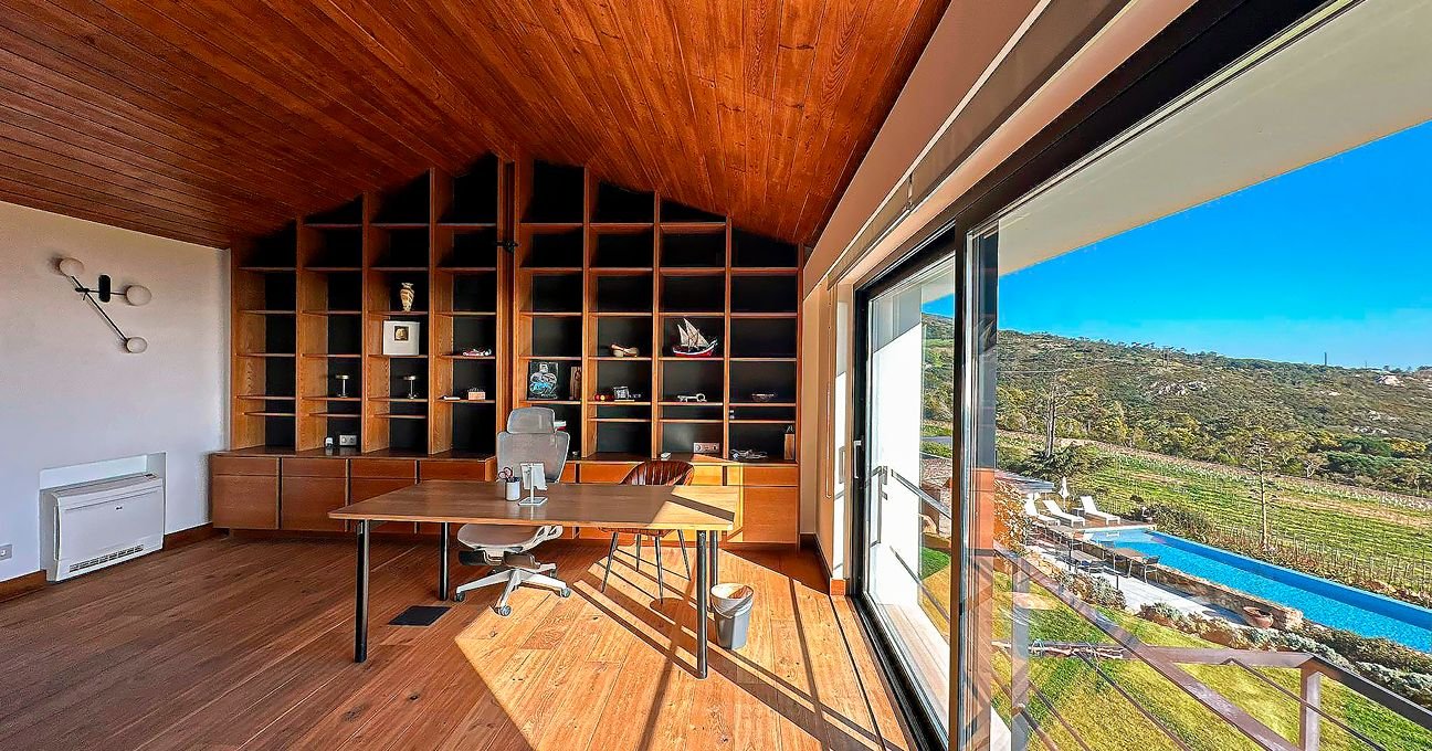 Private office with a writing desk and comfortable seating in the Panorama Residence