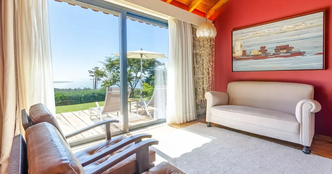Comfortable sofa and armchair in the Malvasia Room sitting area