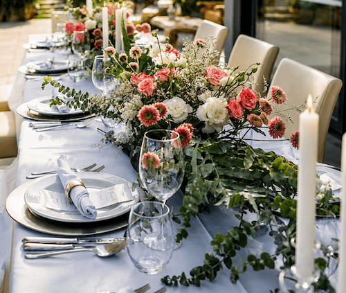 Long table decorated with flowers for an intimate vineyard wedding in Portugal