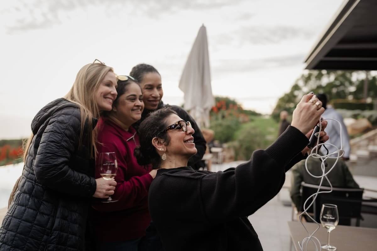 Women taking a picture with Quinta Vale da Roca wine