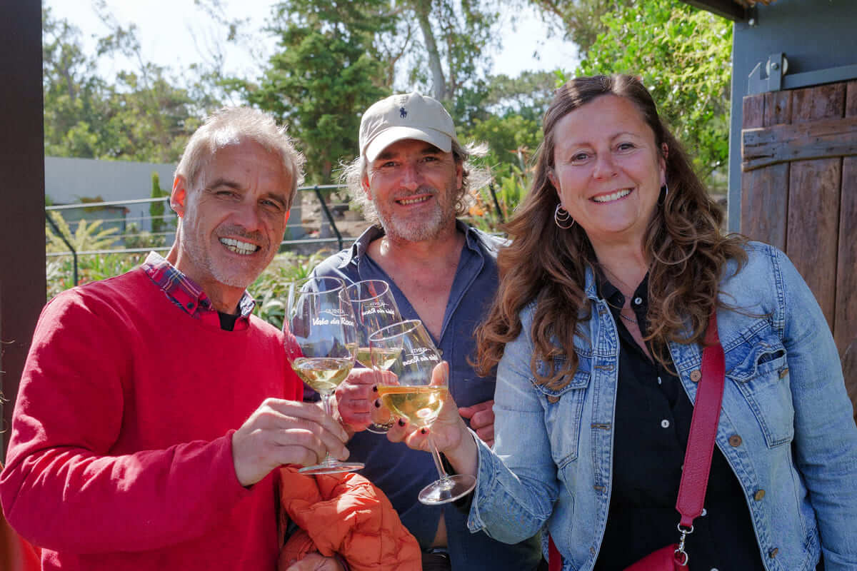 Friends toasting with Quinta Vale da Roca wines during a private anniversary celebration