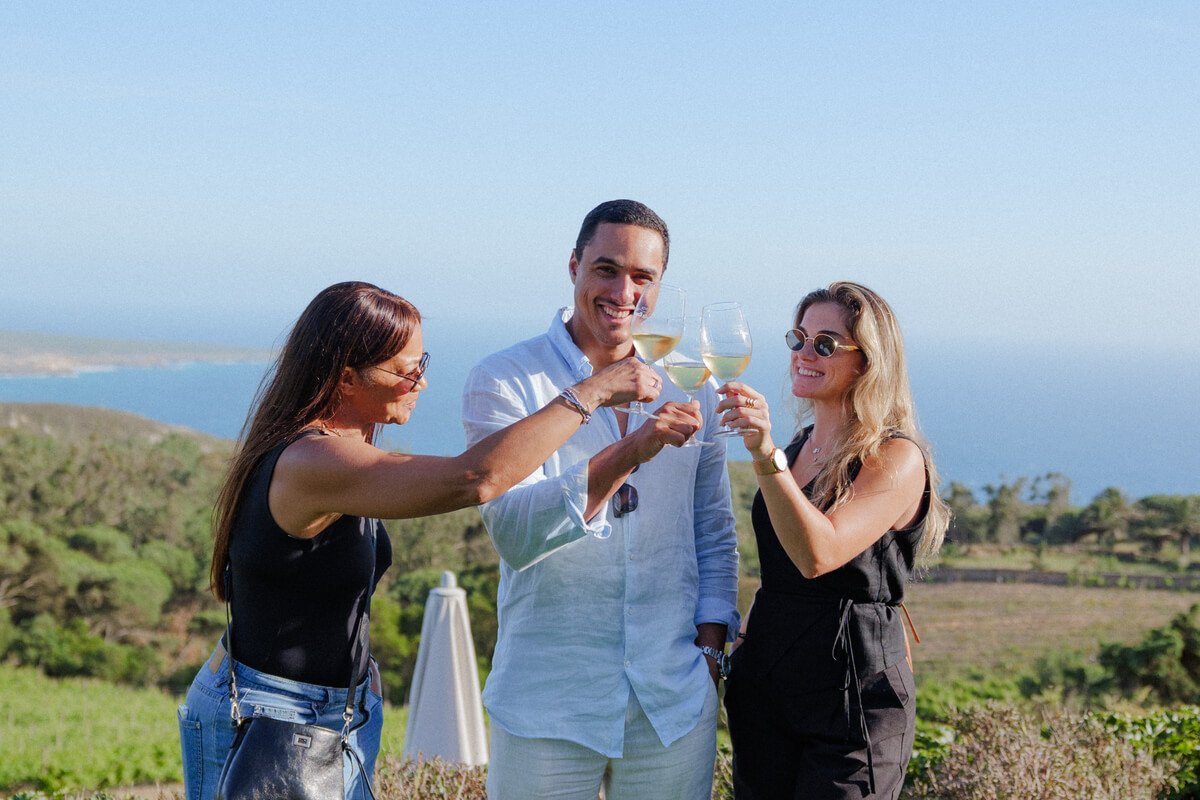Team celebrating a successful corporate event with estate white wines